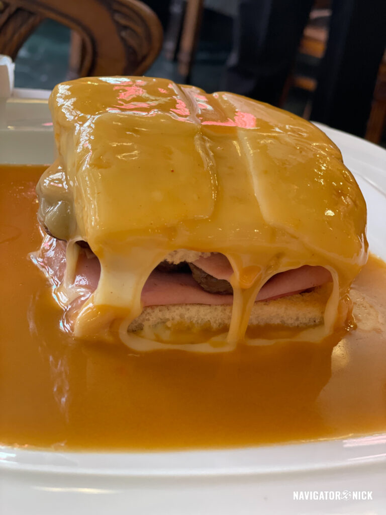 The city’s iconic Francesinha Sandwich has two types of sausage plus ham, steak, bologna, and cheese