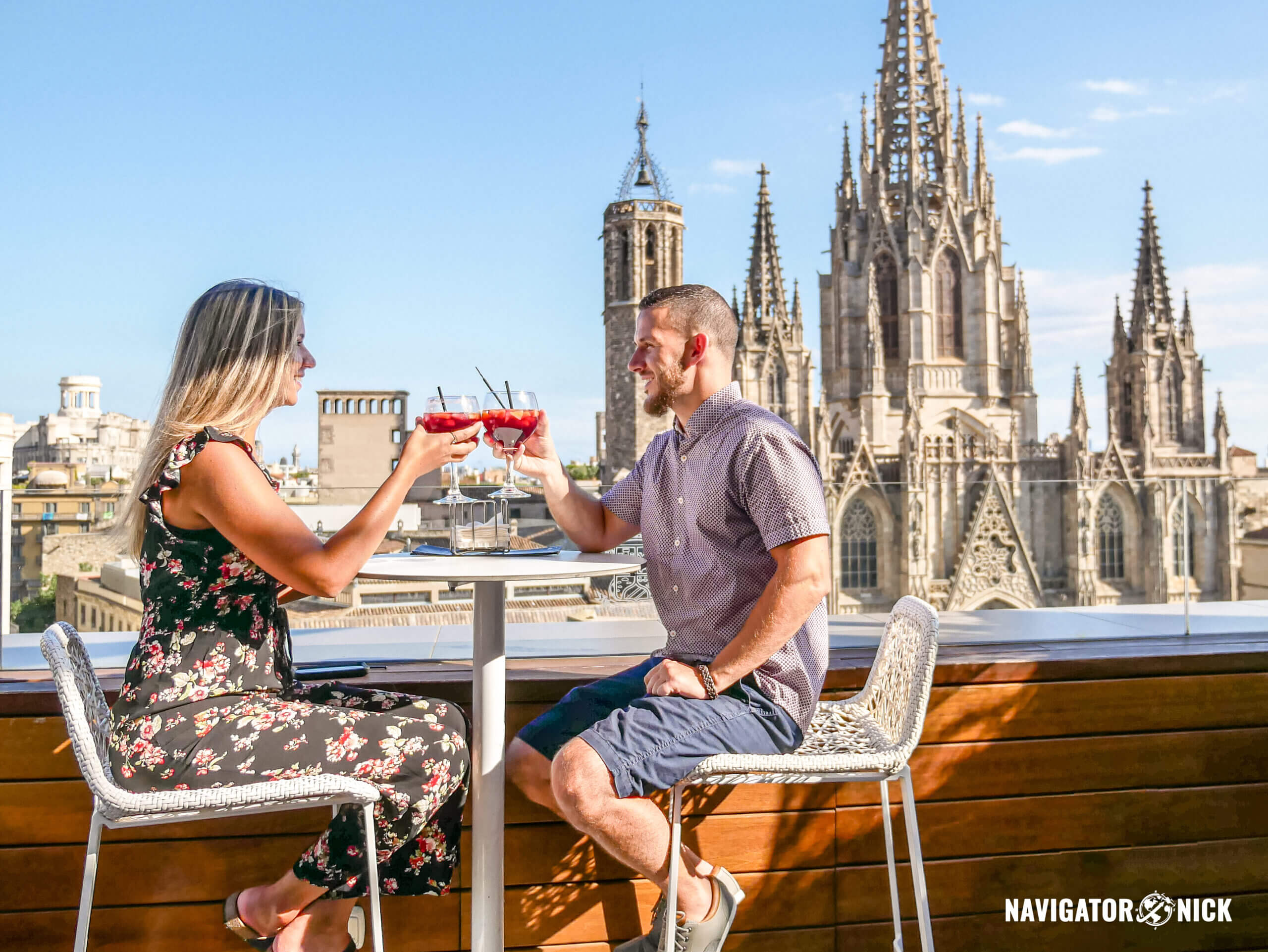 A couple drinking sangria at a rooftop bar